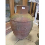 A 20th century terracotta urn 69cm high together with two purple painted metal planters (3)