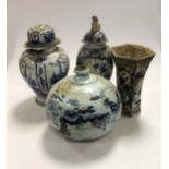 An 18th century Delft charger; three vases; together with lidded jar of squat form, all with