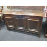 An early 18th century oak coffer, the three fielded moulded panel front on channelled stiles, 66 x