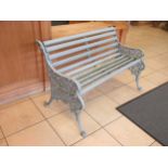 A grey painted cast iron and wooden garden bench, 127cm wide