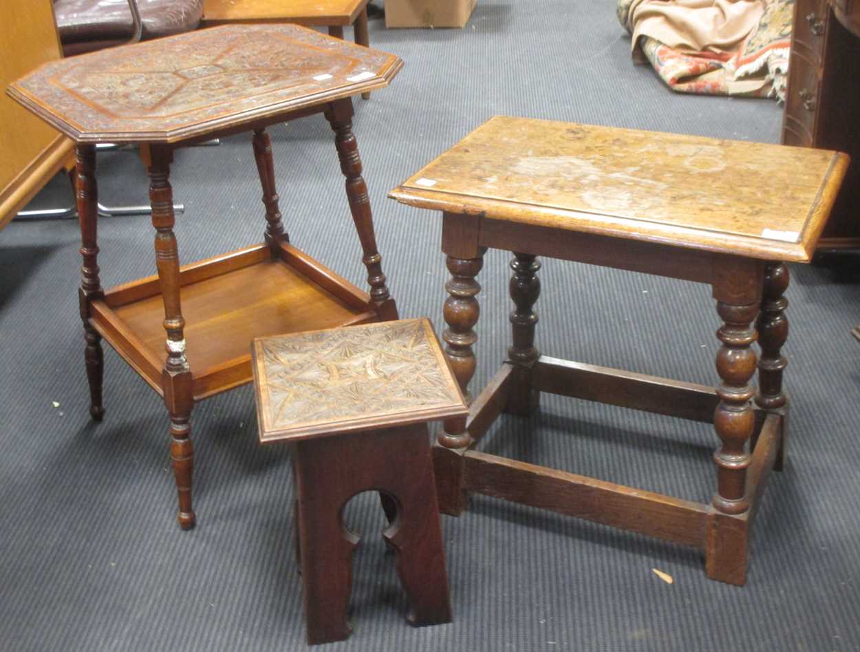 An oak coffee table with joined frame, the top 56 x 38cm, an occasional table with carved top (leg