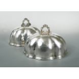 A pair of Victorian silver plated meat covers,