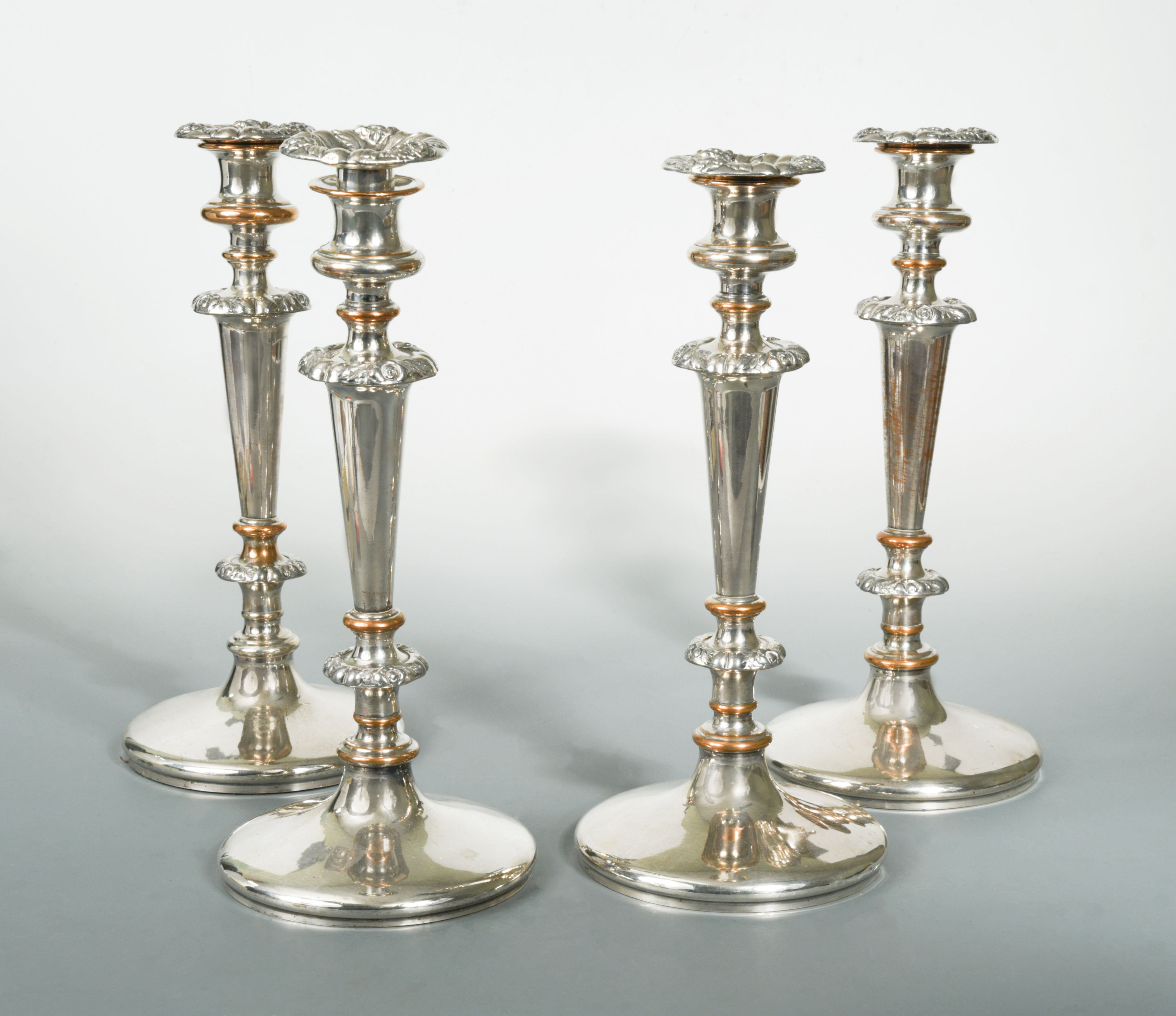 A set of four 19th century Old Sheffield Plate candlesticks,