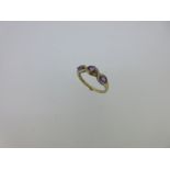 An amethyst and diamond ring set in hallmarked gold,