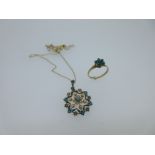 An antique turquoise and seed pearl pendant together with a cluster ring,