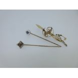 Two seed pearl and gemset stick pins and a similar brooch,