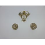 An Edwardian style cultured pearl and seed pearl brooch / pendant and a pair of matched earstuds,