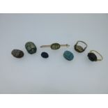 A collection of scarab set jewellery and seals,