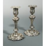 A pair of George III silver candlesticks,