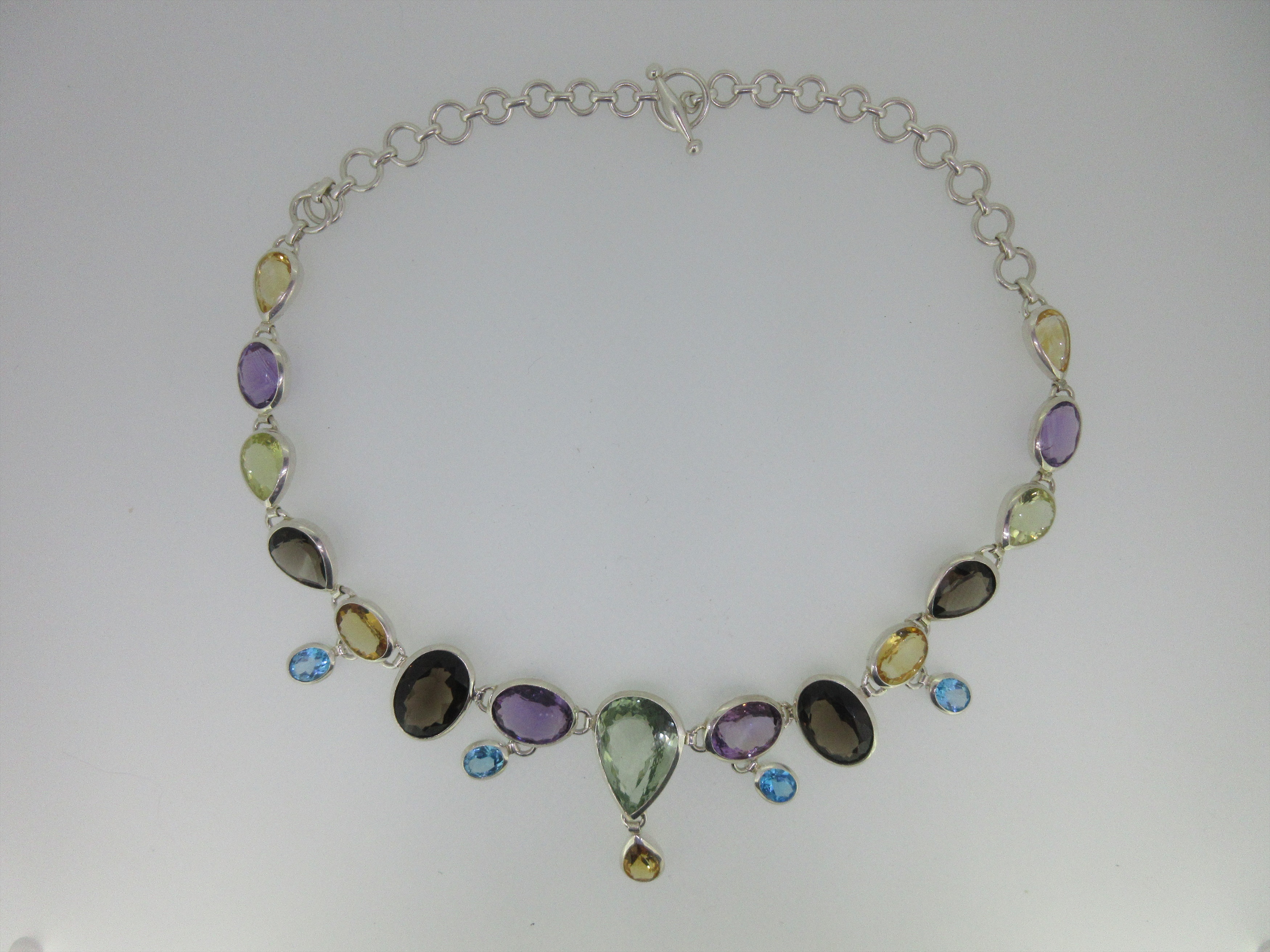 A multi gem necklace set in silver,