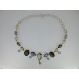 A multi gem necklace set in silver,