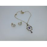 An Edwardian amethyst and seed pearl pendant with chain, and a pair of mabé pearl earstuds,