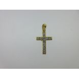 A diamond set cross pendant,