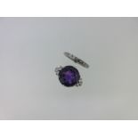 An amethyst and diamond ring together with a full hoop diamond eternity ring,