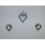 A handmade sapphire and diamond heart suite of a brooch / pendant and screwback earrings,