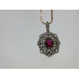 An antique ruby and diamond pendant with later chain,