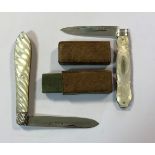 Two Victorian silver and mother of pearl folding fruit knives, one with its original case,