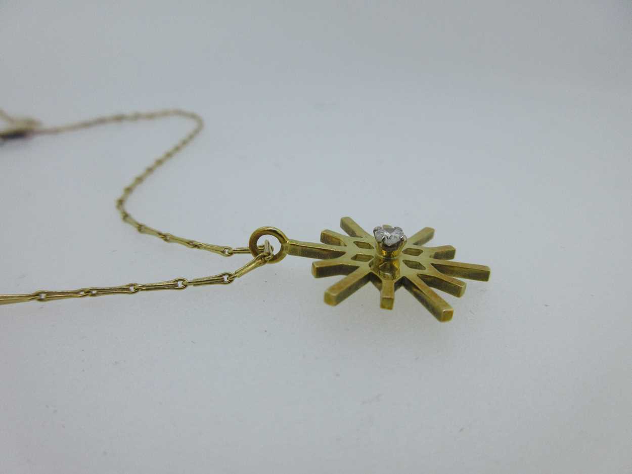 An 18ct gold diamond set snowflake pendant, - Image 4 of 4