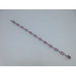A pink sapphire and diamond bracelet set in 18ct white gold,