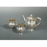 A Victorian silver bachelor's three piece tea set,