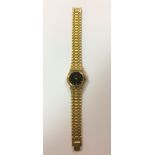 Gucci - A lady's gold plated and diamond set wristwatch,