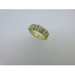 A contemporary vari-cut diamond and 18ct gold half hoop ring,