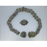 An Austro-Hungarian gem embellished brooch together with a Russian filigree work belt,