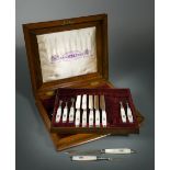 A cased set of Victorian silver and mother of pearl fruit eaters,