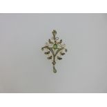 An Edwardian peridot and seed pearl pendant / brooch,