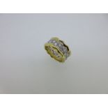 An unusual diamond full hoop band ring,