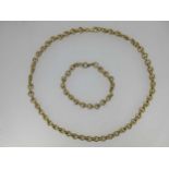 A 9ct gold fancy link necklace and bracelet suite,