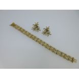 A 9ct gold bracelet and pair of earrings,