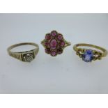 Three hallmarked gold and gemset rings,