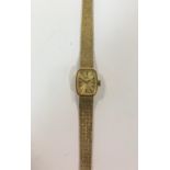 Tissot - A lady's 9ct gold wristwatch,