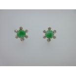 A pair of jadeite jade and diamond earrings,