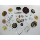 A collection of loose gemstones,