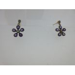 A pair of amethyst and diamond daisy earstuds,