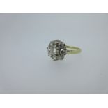 A diamond flowerhead cluster ring,