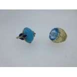 Two gold and vivid blue gemset dress rings,