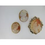 A loose cameo of a youthful Bacchus, an Arthurian cameo brooch and another,