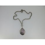 A Victorian silver locket and chain,