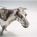 A 19th century Dutch silver naturalistic cow creamer,