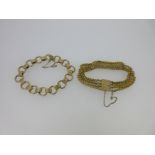 Two fancy link gold bracelets,