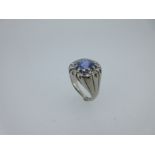 A lilac coloured sapphire and diamond cluster ring,