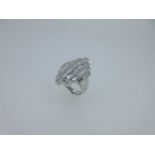 A modern baguette cut diamond dress ring set in 18ct white gold,