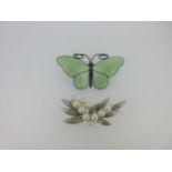 A vintage enamel butterfly brooch and another brooch set with cultured pearls,