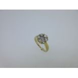 A diamond flowerhead cluster ring set in 18ct gold,