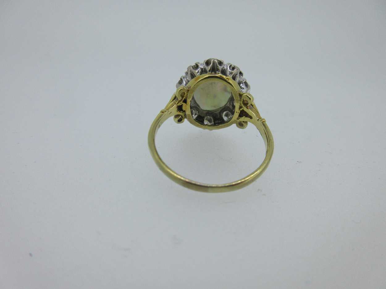 An opal and diamond cluster ring set in hallmarked gold, - Image 5 of 6