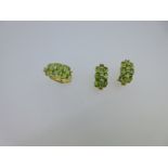 A peridot and diamond ring and earring suite,