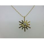 An 18ct gold diamond set snowflake pendant,